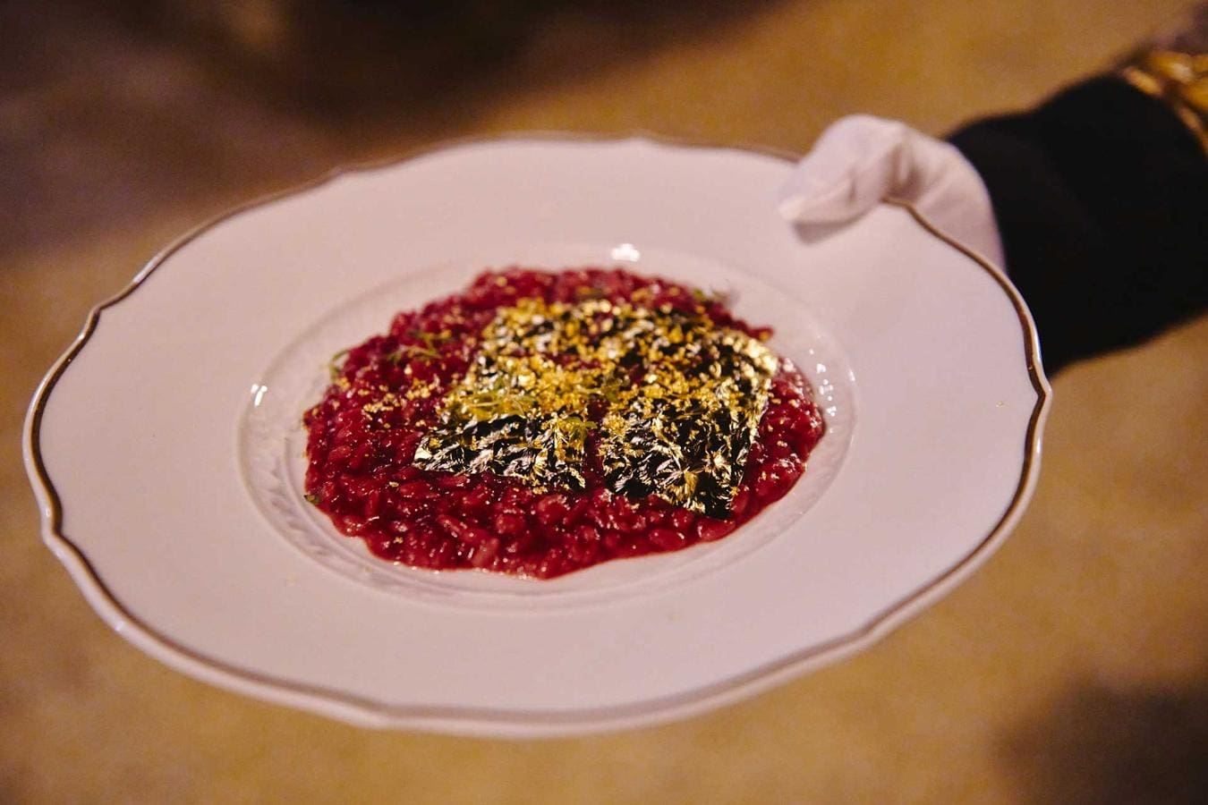 “Red beetroot risotto with gold leaf”